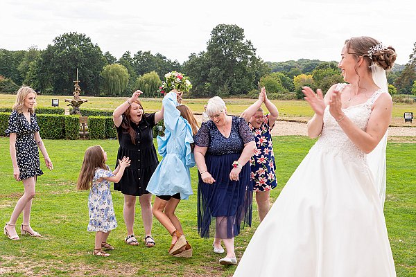 Guests laughing during a Gosfield Hall wedding celebration