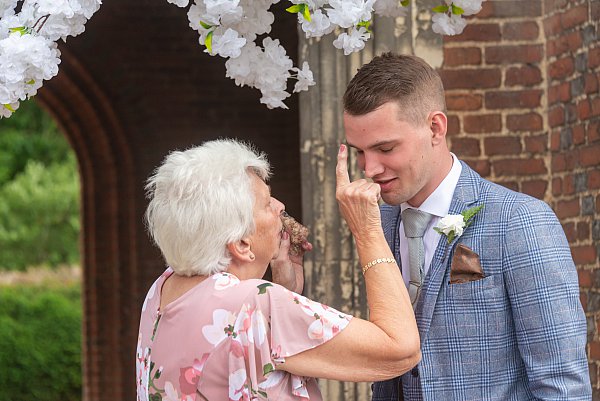 Wedding guests arriving for a Leez Priory wedding ceremony in Essex