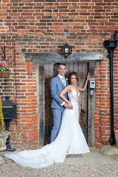 Relaxed wedding portraits in the gardens at Leez Priory, Essex