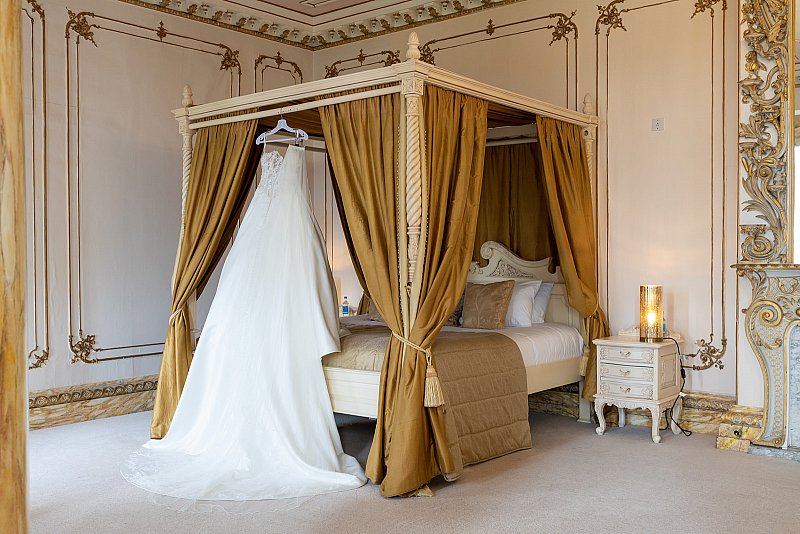 Gosfield-hall-Wedding-Dress-on-4-poster-bed.jpg